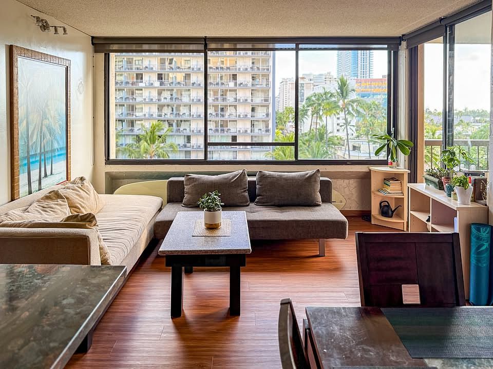 Comfortable shared living space with lots of light. We have recently replaced this sofa with a newer sectional.