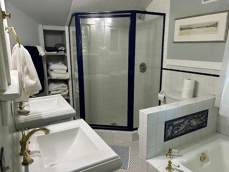 Upstairs bathroom does double duty with soaking tub, walk in shower and two sinks.