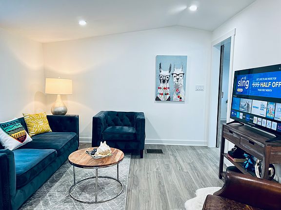 Relax in comfortable living area with 50" smart tv.
