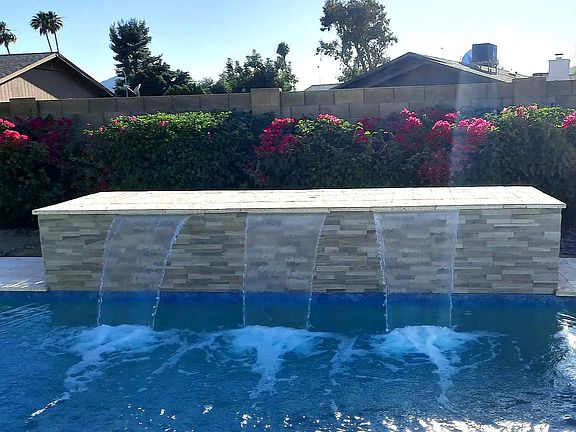 3 spout water feature on heated pool