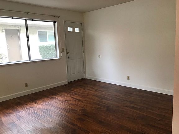 Large family room with access to alley and garage