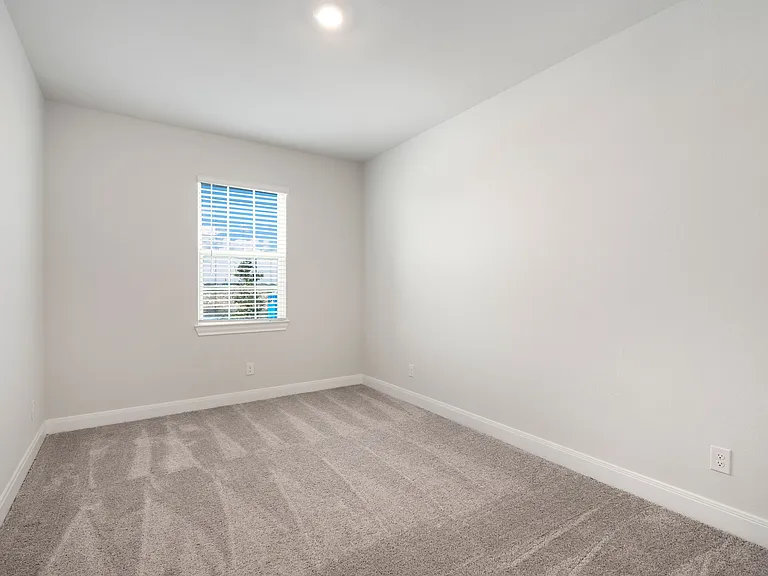 The additional bedrooms have lush carpet flooring.