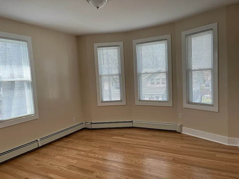 Spacious living room, Thermal windows, gorgeous hardwood floors.
