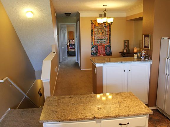 Prep island in kitchen, looking into dining area
