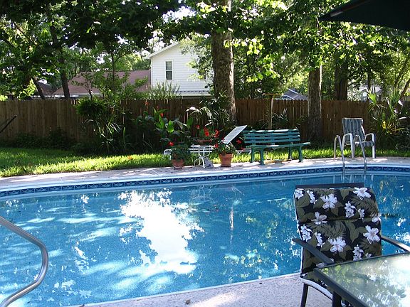 shaded pool in backyard