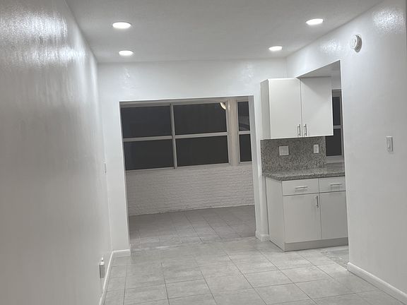 view from Living Room into Dining and Family rooms