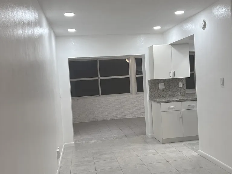 view from Living Room into Dining and Family rooms