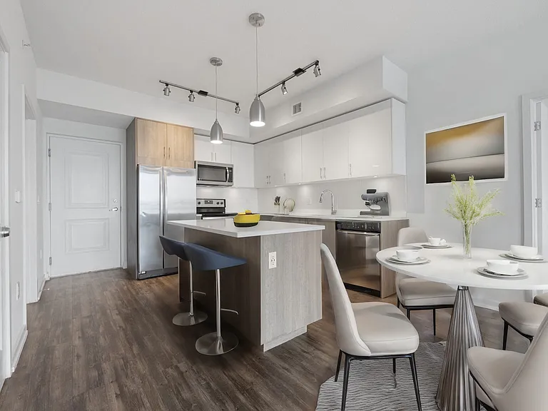 Kitchen islands and space for a dining table.