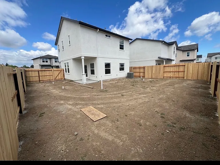 Huge fully- fenced backyard with covered patio-plenty of room.