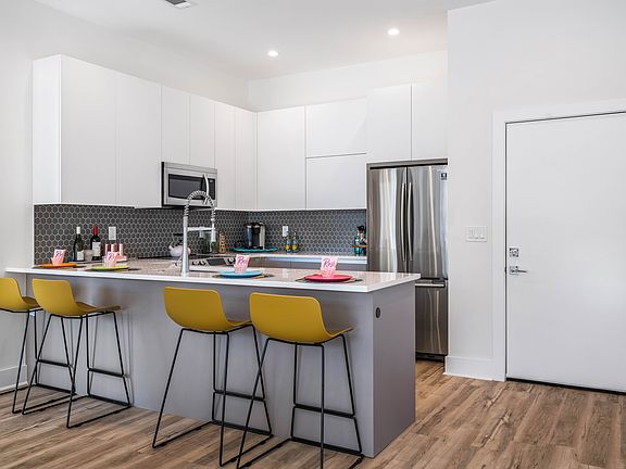 Custom chef s kitchen with stainless steel appliances. Model Unit