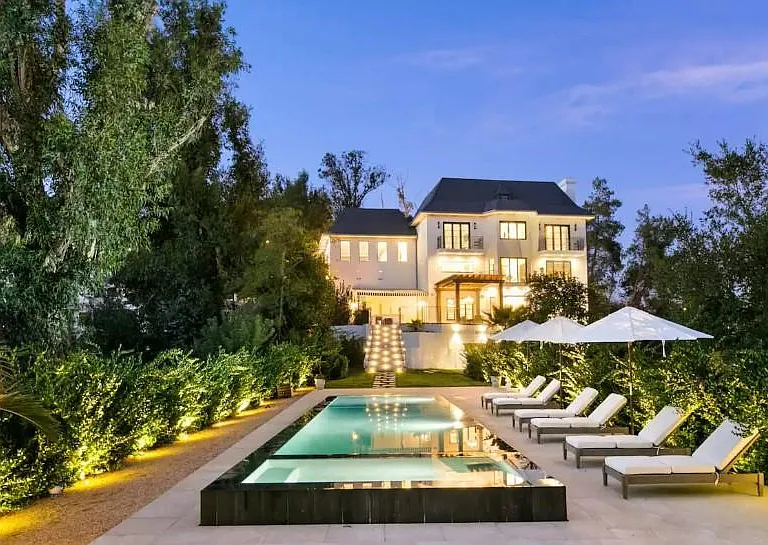 Take a nighttime swim in this incredible zero edge pool.