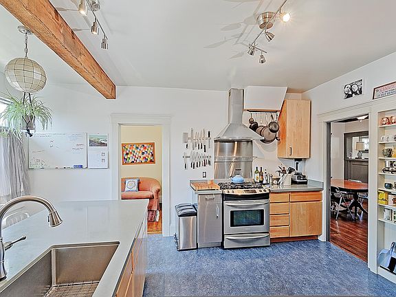 (taken from back door/ laundry room) Kitchen also has doorways into hallway, dining room and office/ lounge or 3rd bedroom (pictured at center)