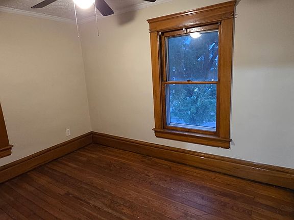 large bedrooms with hard wood and natural trim