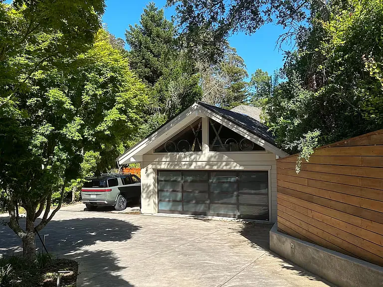 Bottom of driveway with driveway pad that can accommodate up to four cars