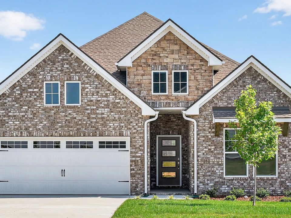 Exquisite brickwork and modern gabled roof design define this Harpeth residence in McClure Farms.