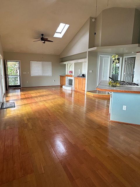 Open plan with vaulted ceiling & Skylights