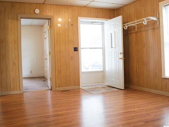 Family room looking at front door and bedroom #1 door