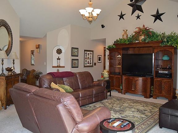 Family room with beautiful floor to ceiling brick fireplace.