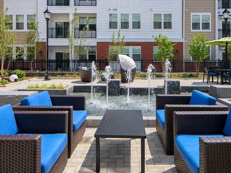 Courtyard for outdoor living, offering gorgeous water feature, cabana, pergola lounge area and grilling station