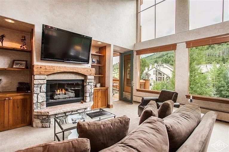 Living area with floor to ceiling windows