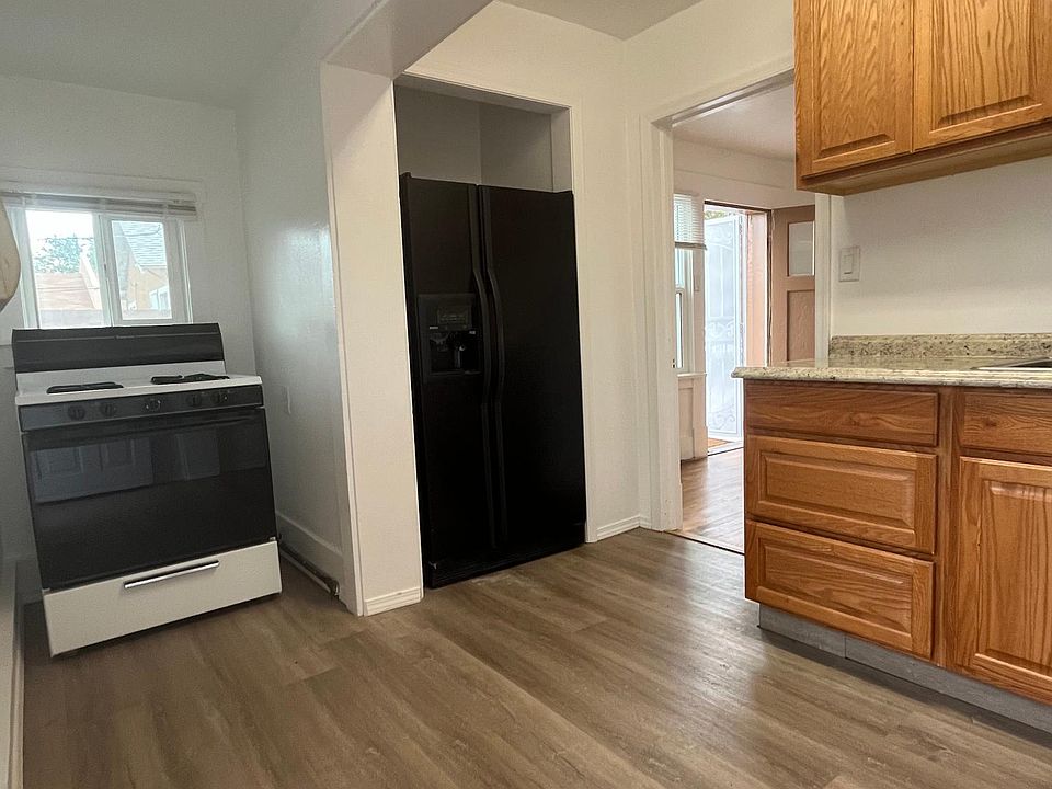 Gas stove, recessed refrigerator, new cabinets, sink and counter