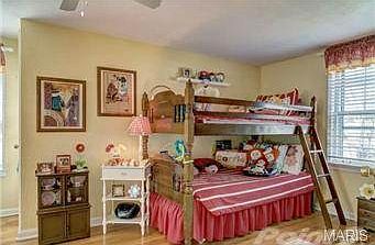 West Bedroom (photo 2).  Beautiful floors + ceiling fan.