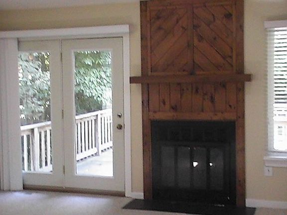 Fireplace with heatolater, french doors to large deck
