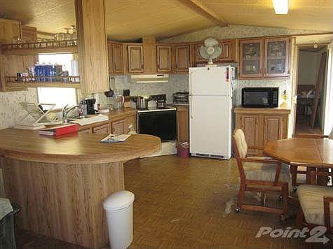 VIEW OF KITHEN FROM LIVING ROOM