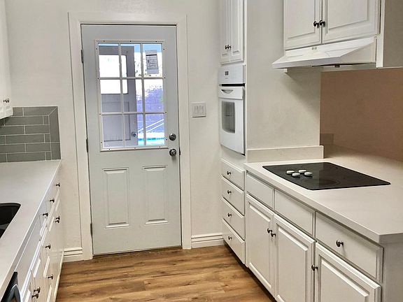 Kitchen with Brand New countertops, backsplash sink and dishwasher