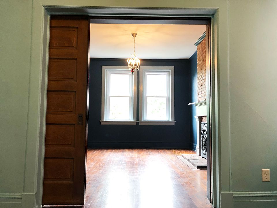 pocket doors between the living room and first bedroom