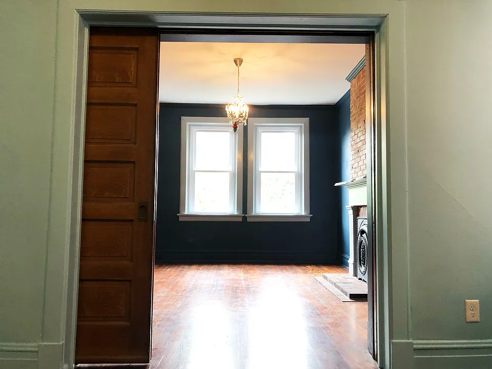 pocket doors between the living room and first bedroom
