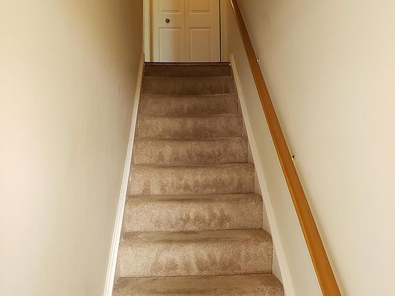 ENTRY WAY STAIRS TO FIRST FLOOR STORAGE CLOSET AT TOP ENTRY