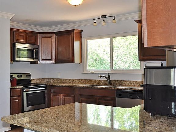 Kitchen with stainless steel appliances and granite counter tops