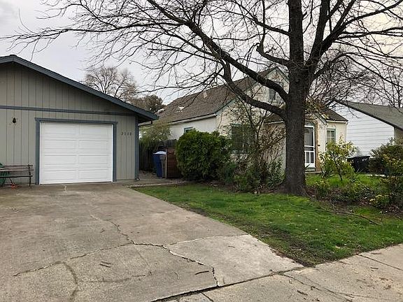 Front of duplex with one car garage with automatic garage door opener