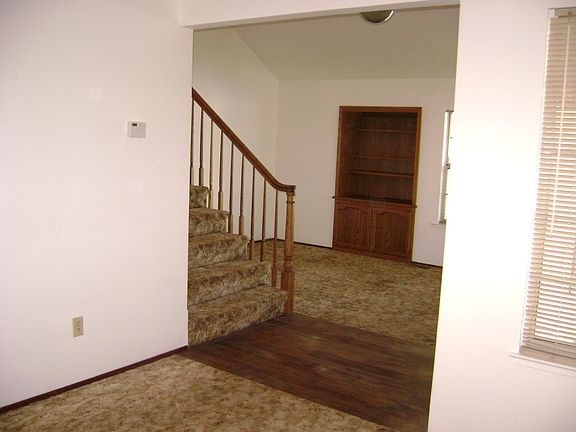Living room back ground, entryway & stairs, dining room forefront