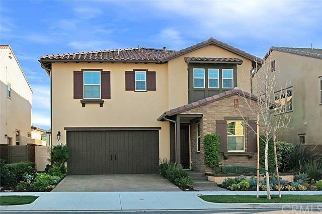 Front of home beautifully landscaped
