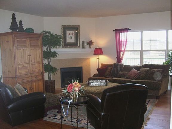 Living room with gas fireplace and big windows