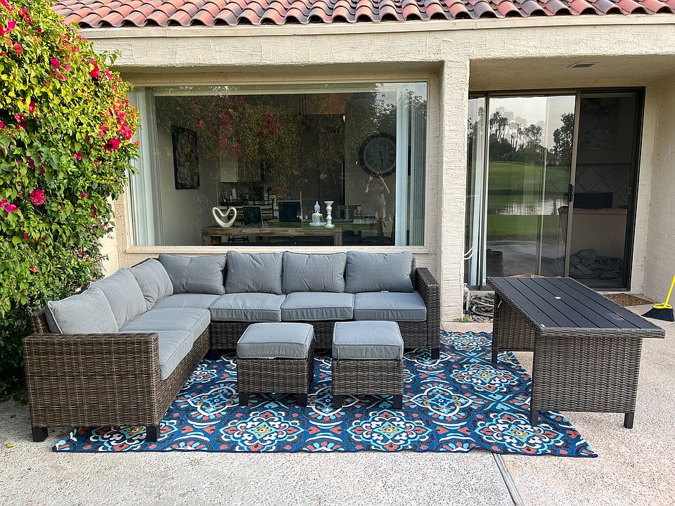 Outdoor couch with side tables, dining table, fire pit with four chairs. (Gas grill)