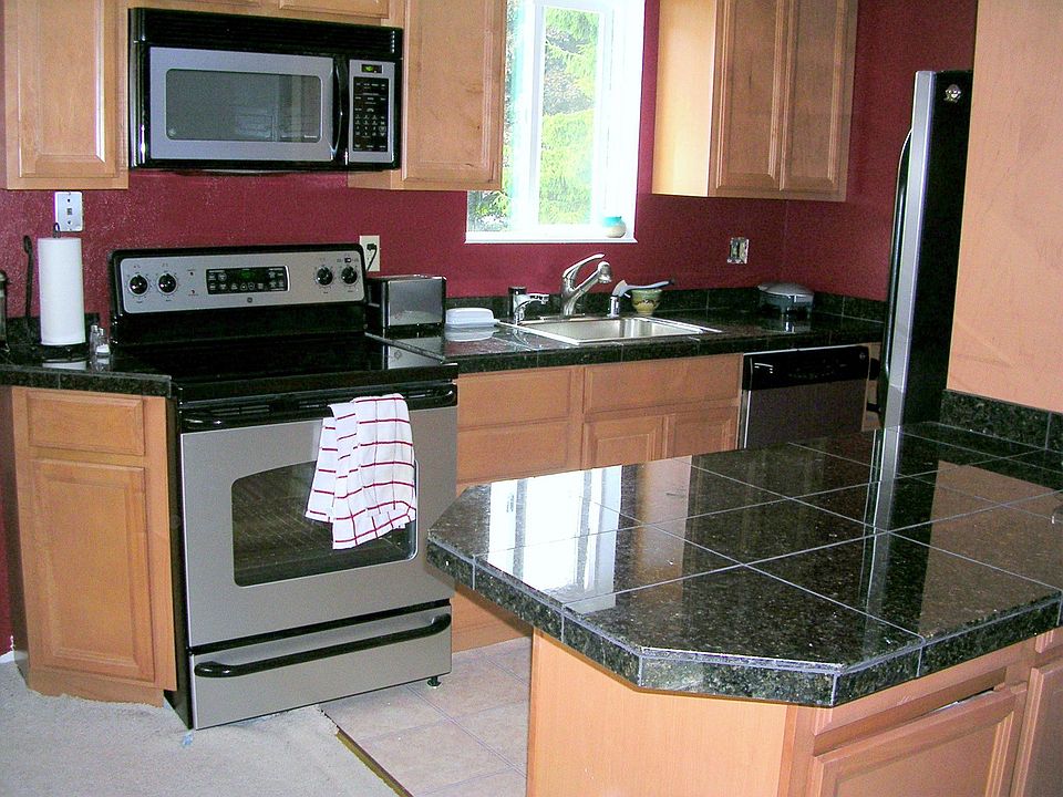Remodeled kitchen with granite countertops 