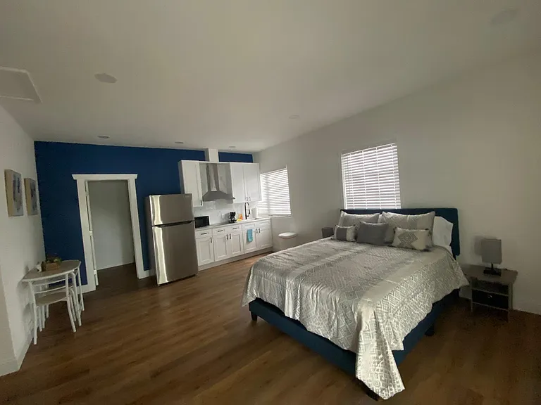 Queen bed, premium linens, cozy pillows & nightstands with lamps.
