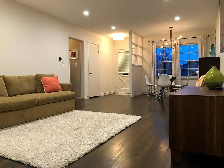 Living/dining area with recessed lighting and smart thermostat for heating and cooling