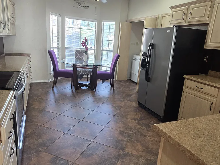 Spacious kitchen attached to main living room with breakfast nook and over 35 feet of countertop space.