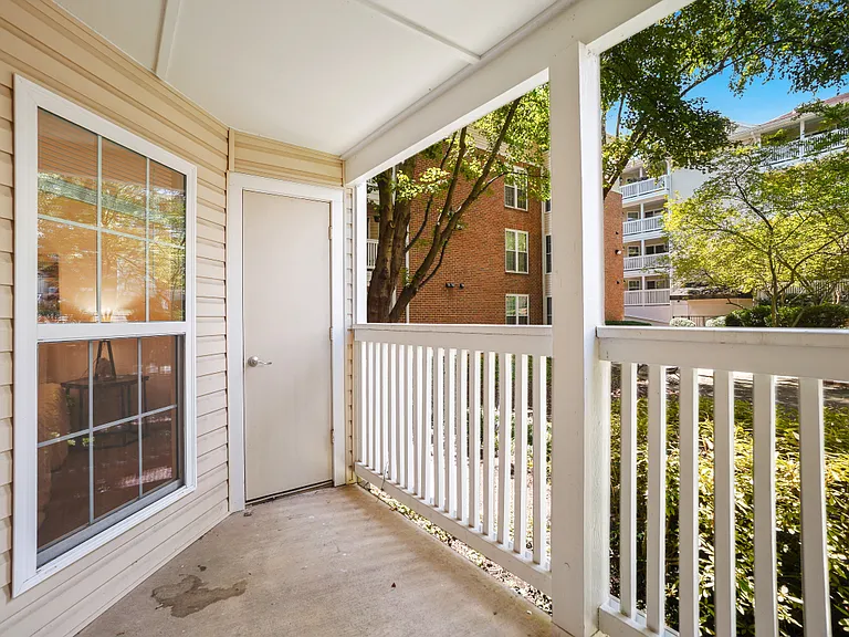 Your own covered balcony with separate storage room.