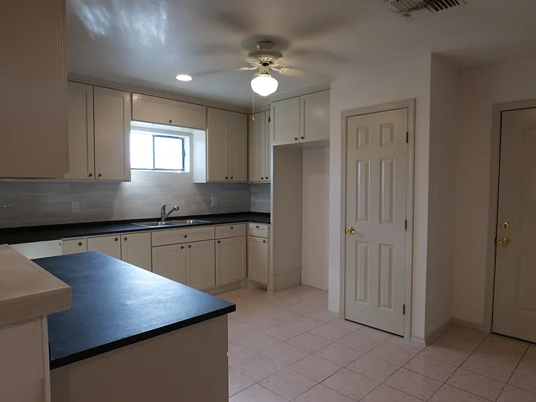 Kitchen with pantry. Microwave stove and fridge included in home (not shown).