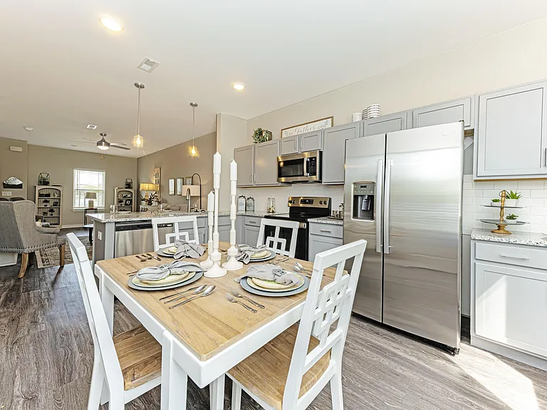 Kitchen with granite counters, stainless appliances, and modern cabinetry