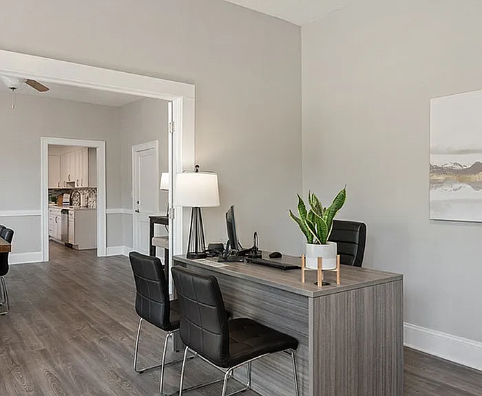 Step into a beautifully designed office space, seamlessly transitioning into a chic kitchen.