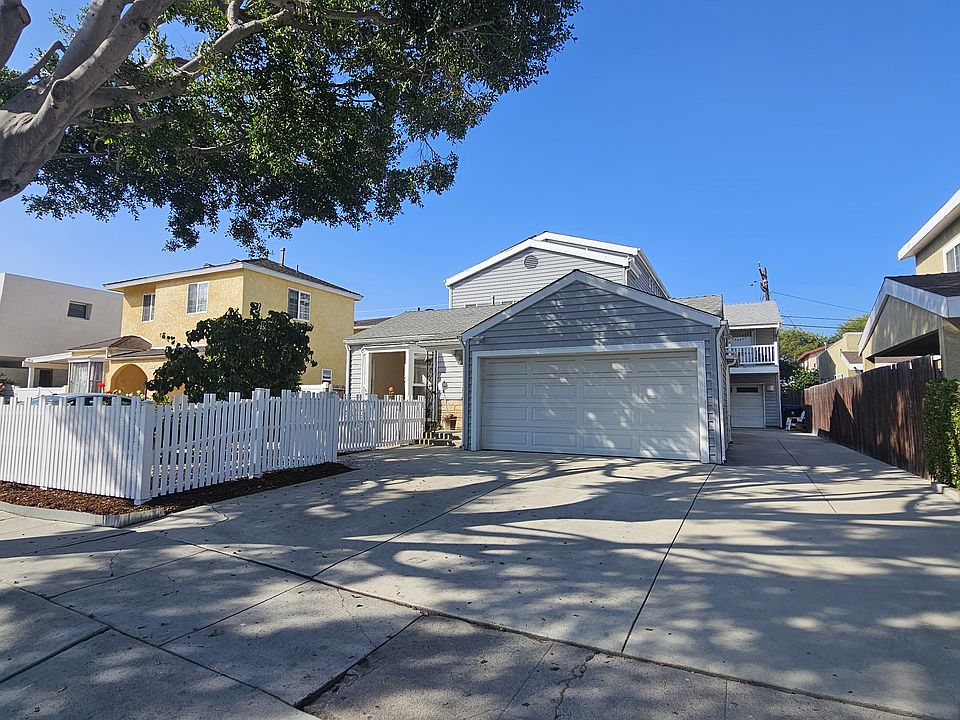 2 Car Garage + Tandem Off Street Parking / Picket fence around private yard.
