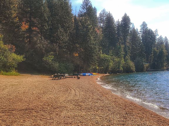 There is a large swath of pebbly beach head to enjoy Lake Pend Oreille