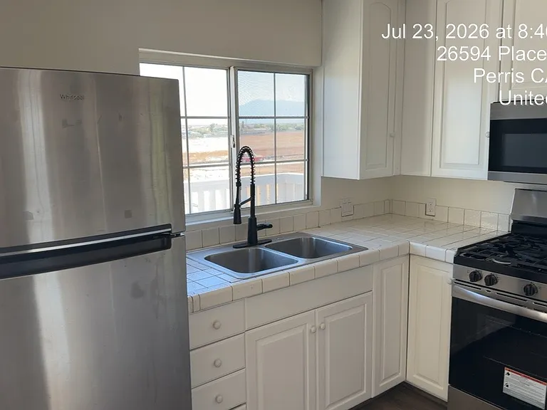 Kitchen with new stove and microwave