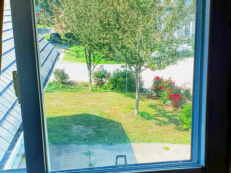 View of parking area from apartment, on 2nd floor.